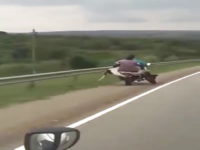 Two blacks with cow travel on bike..