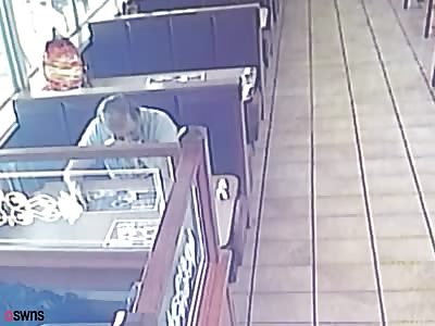 Restaurant customer caught on CCTV slapping waitress on backside