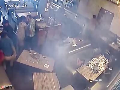 Man shirt goes on fire in a restaurant - after his mobile phone explodes