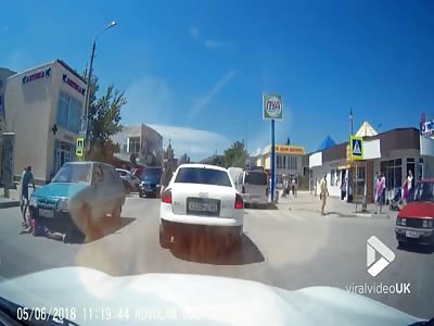 Girl crossing road nearly gets completely run over