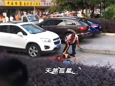 crazy man open belly of the victim in street and cut his guts out