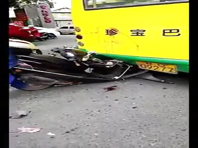 biker crashes into the back of the bus
