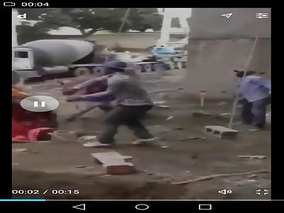 Brutal shovel fight between two workers.