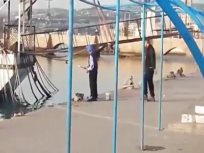 asshole pushes old man in the sea