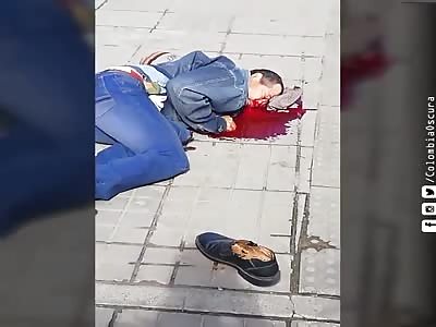 man convulsing after brutal stabbing in the neck