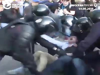 russian police brutality trying to break legs of protester