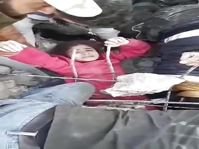 saving little girl after Syrian regime air strikes
