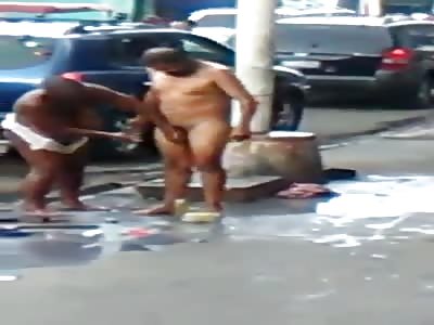 Venezuelan old couple taking shower nude in street 