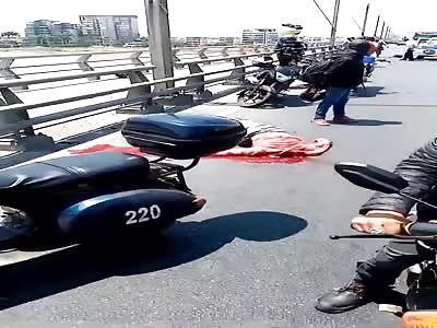 (Different angle) A headless corpse of men lying in the street after horrific accident 