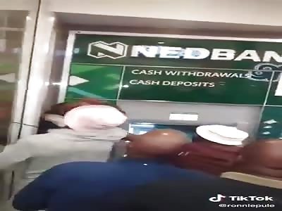 ATM scammer caught....gets the beating of his live 