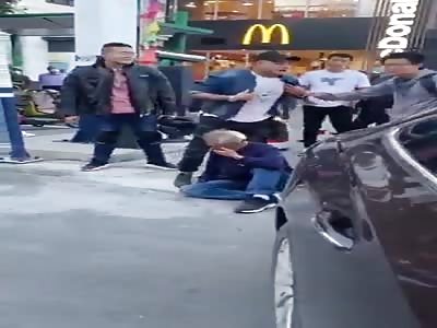 Chinese asshole knocks over and humiliates old man in the street.