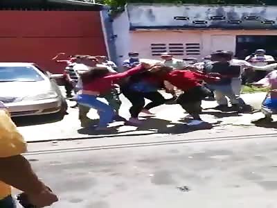 Venezuelan female mayor wearing black takes beating from two angry woman