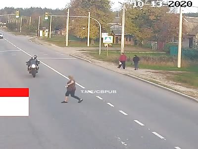 Old woman run over by big motorcycle gets her arm sliced 