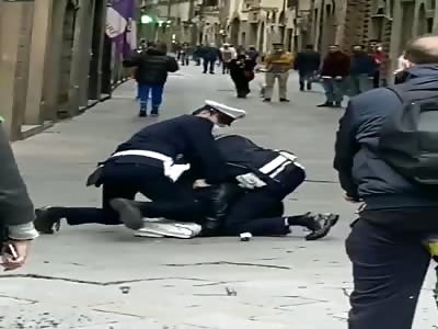 Italian police dealing with young man for not wearing mask .