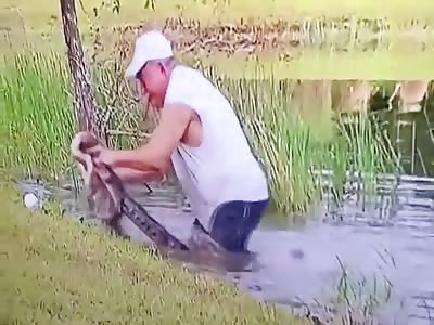Old man save puppy from the jaws of little crocodile 