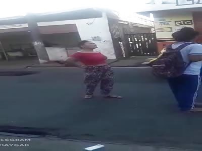 Busty girl fighting in the street 
