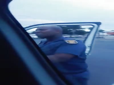 A drunk police man trying to enforce law by hitting a citizen!  
