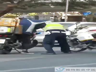 Angry Chinese man on motorcycle beat the shit out of police officer