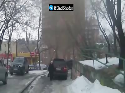Old Russian woman crushed under big car