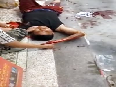 Chinese man victim of brutal accident lying on the ground.