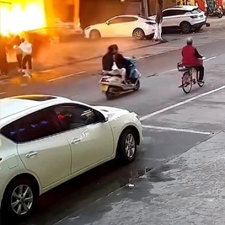  Chinese Restaurant Explodes Due To Gas Leak, Knocks Down Passing Motorcycle.