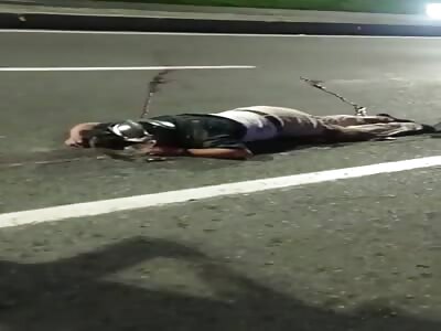 Motorcyclist laying dead on the street after deadly accident 