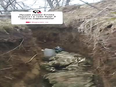 Ukranian soldiers showing dead Russian 