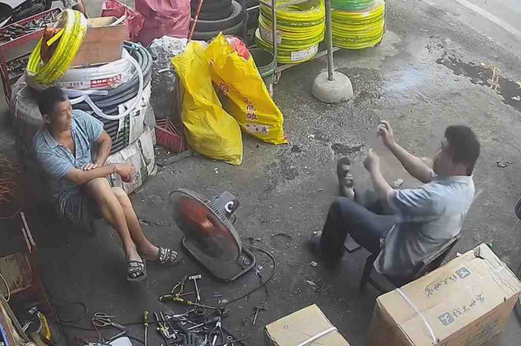 Man Talking To His Friend Suffers A Sudden Seizure