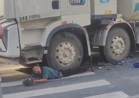 Man Crushed By Truck Wheel Is Still Alive
