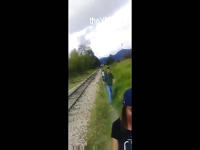 Slow Train Hits A Distracted Woman