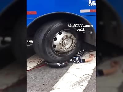 motorcycle crushed by bus {two angles}
