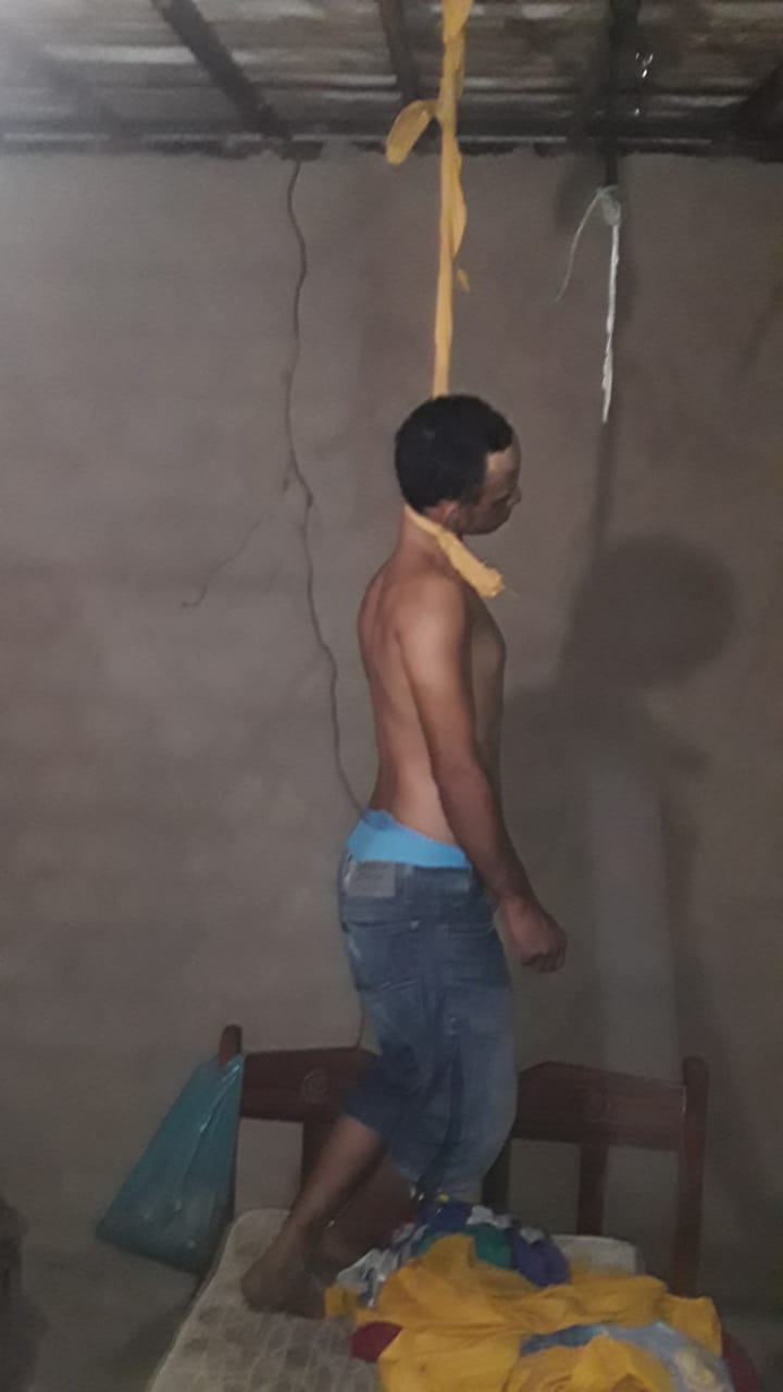 Suicide man hangs himself on a rope to kill himself 