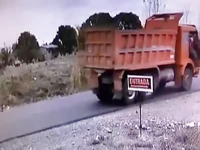 A Bad Day .. Motorcyclist Crashes into Dump Truck.