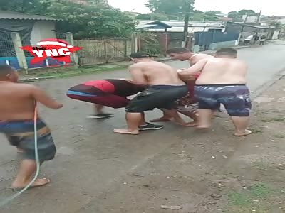 favela brazil. man brutally beaten for not following the rules 