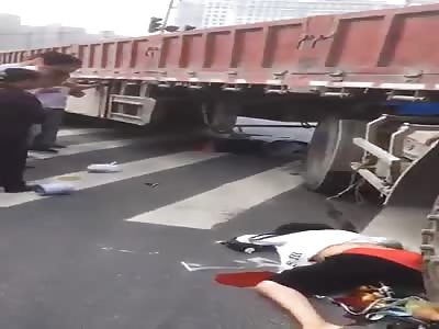 A normal day in China, woman crushed by truck.