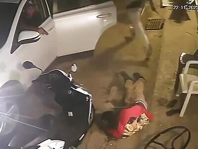 HE'S BEING KILLED BY SHOTS AND MACHETE BLOWS