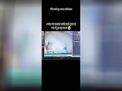 WOMAN JUMPS UNDER TRUCK WHEELS, DIES LATER