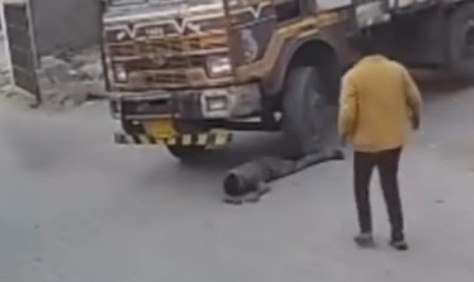 THERE'S A TRUCK ON TOP OF A GUY