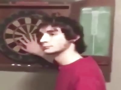 Wtf !! Guy takes a dart in the head and doesn't realize it