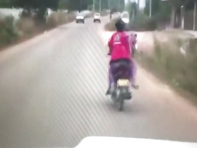 WTF!! Man beat his wife while riding a scooter and then wipes out hard