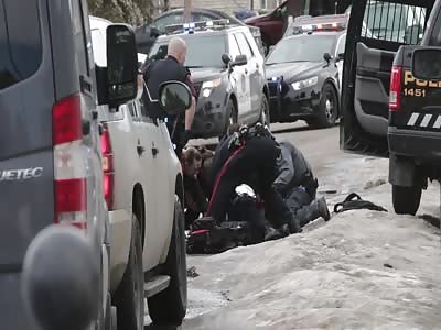 CALGARY POLICE OFFICER SHOT OFFICERS TRY TO SAVING HIS LIFE