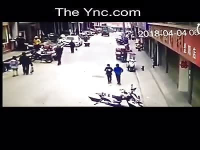 Crazy man on a loader runs over a lady and attempt to kill others