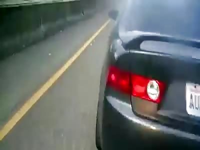 Motorcycle crashes into car