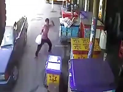 Shopkeeper Almost Get Hit By Huge Tire