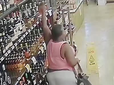 No Shame In Her Game: Woman Caught Stealing Multiple Bottles Of Liquor
