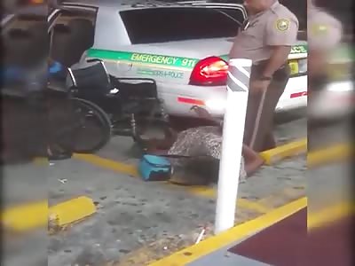 Police throw wheelchair on handcuffed floor