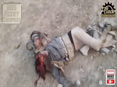 A dead daesh terrorist and one caught in a hole