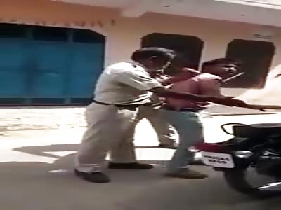 Haryana police beating a man.