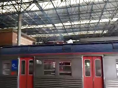Man Burning Alive Falls and hit his head after being electrocuted on the train