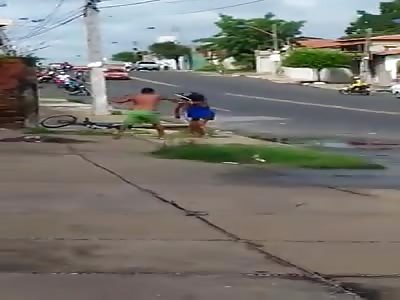 Woman picks up a stick and a man comes to help